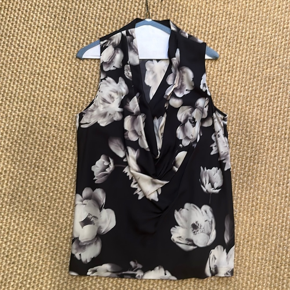 Beautiful floral top with draping neckline.